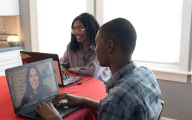 Students working with their laptops