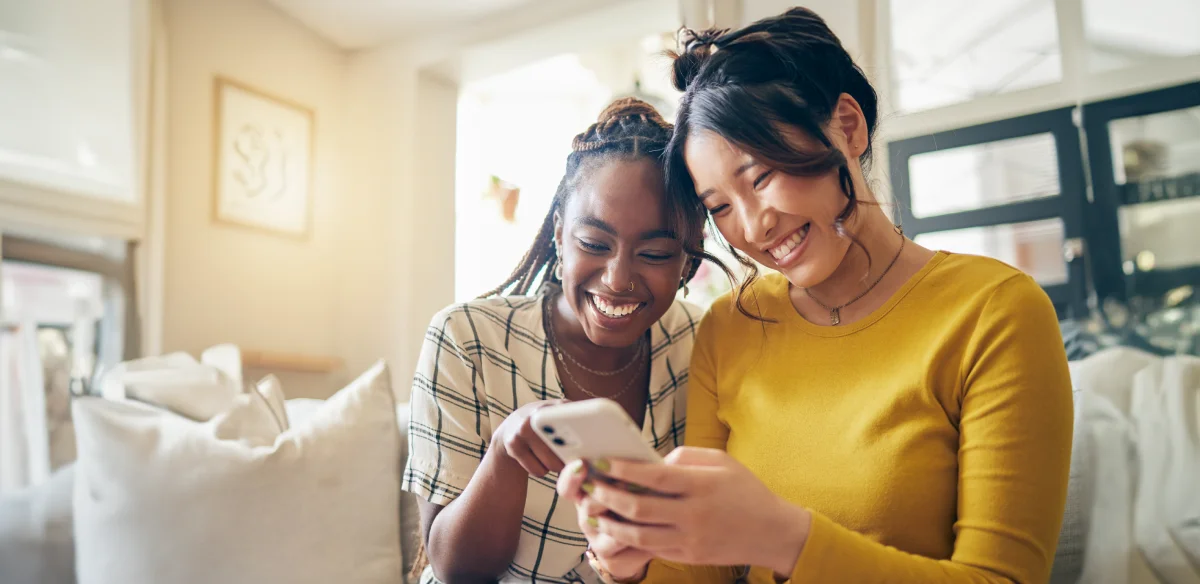 Two students looking at their cellphone